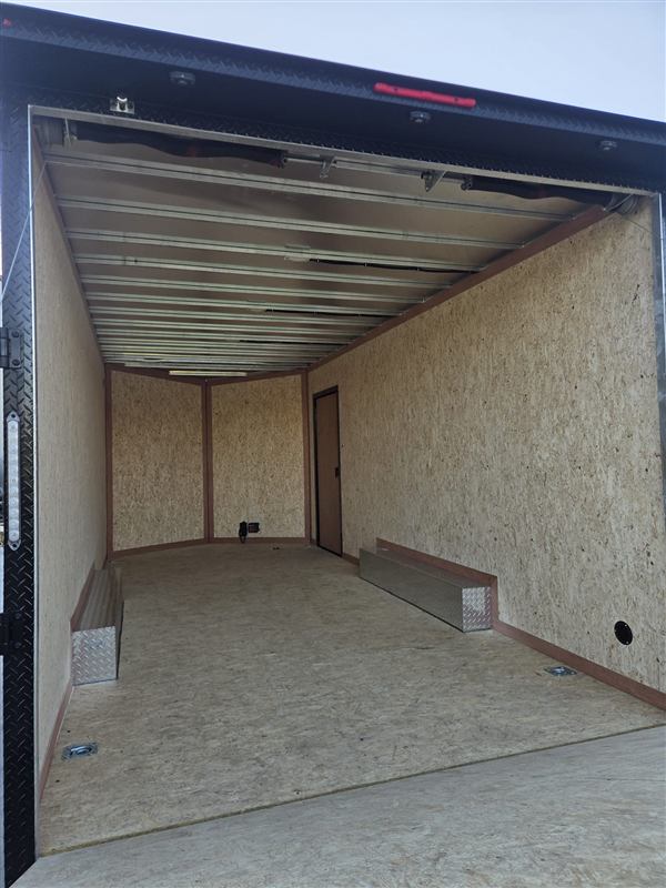 Open trailer showing the cargo floor, lined walls and roof framing